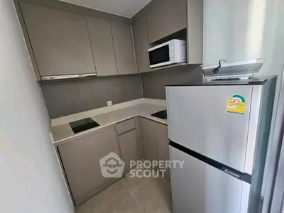 Modern kitchen with sleek cabinets and stainless steel appliances