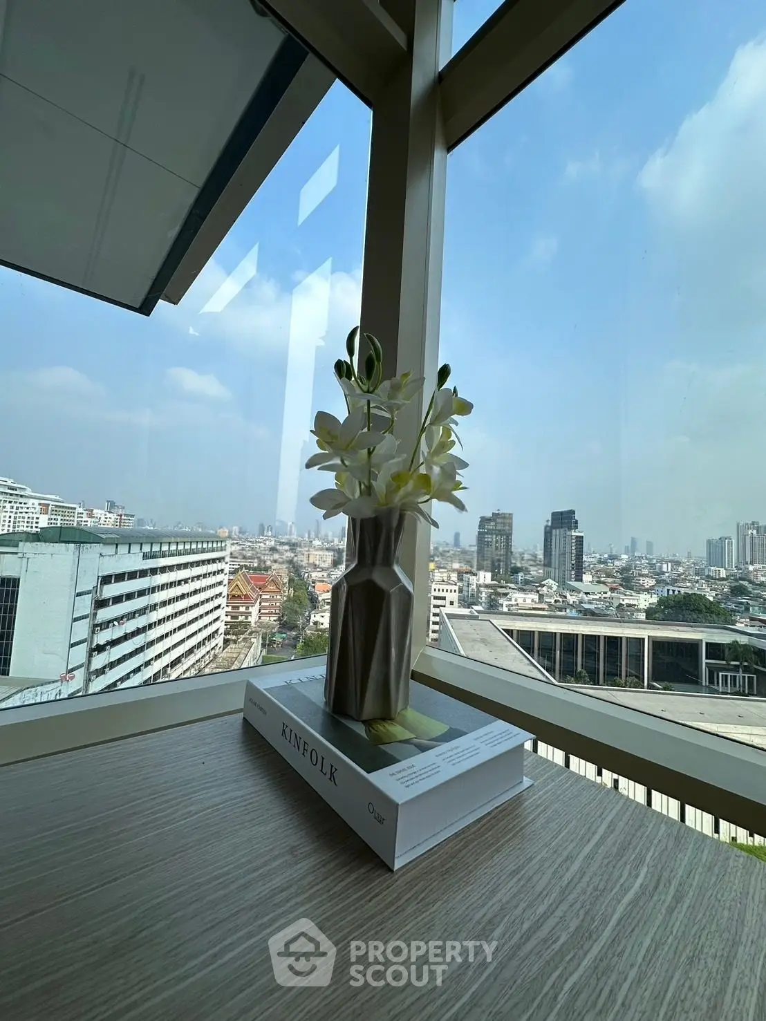 Stunning city view from a modern high-rise corner unit with elegant decor