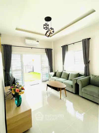 Bright and modern living room with stylish furniture and natural light.