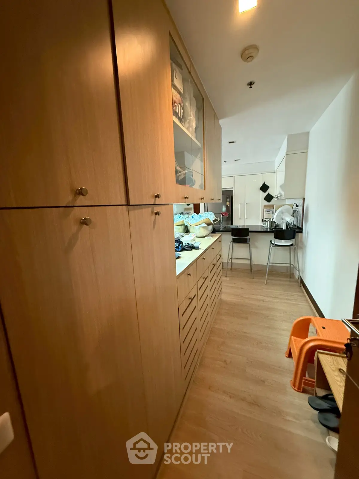 Spacious kitchen with ample wooden cabinetry and modern appliances