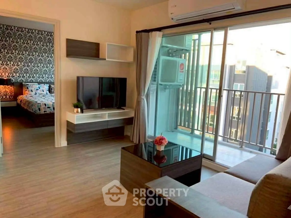 Modern living room with balcony and stylish decor in urban apartment