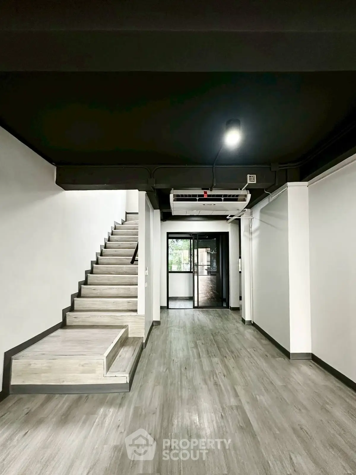 Modern interior with sleek staircase and open layout