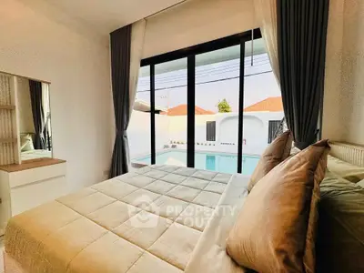 Cozy bedroom with pool view and elegant decor