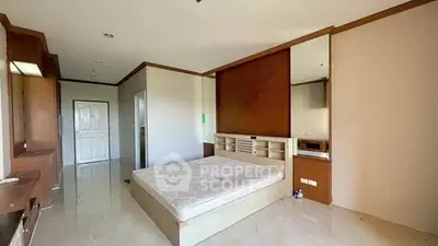 Spacious bedroom with modern design and ample natural light