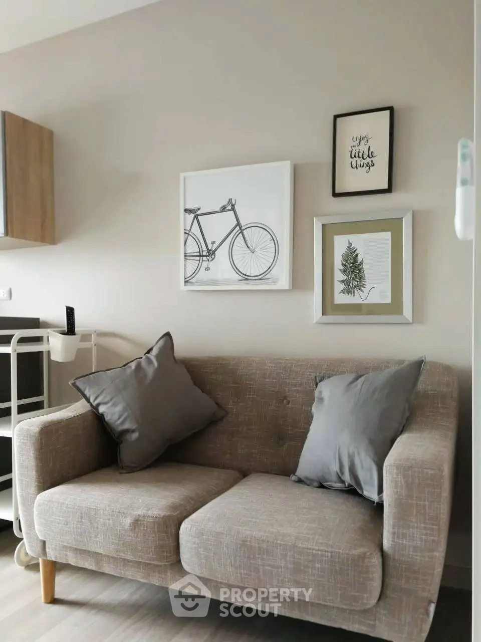 Cozy living room with stylish sofa and modern wall art, perfect for relaxation and comfort.
