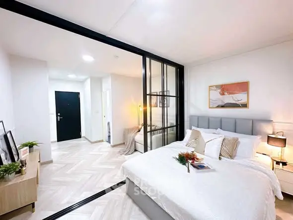 Modern bedroom with glass partition and stylish decor