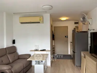 Cozy living room with modern furniture and air conditioning in a compact apartment