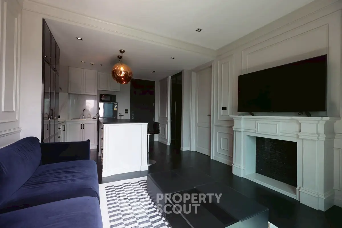 Modern living room with sleek kitchen and stylish decor