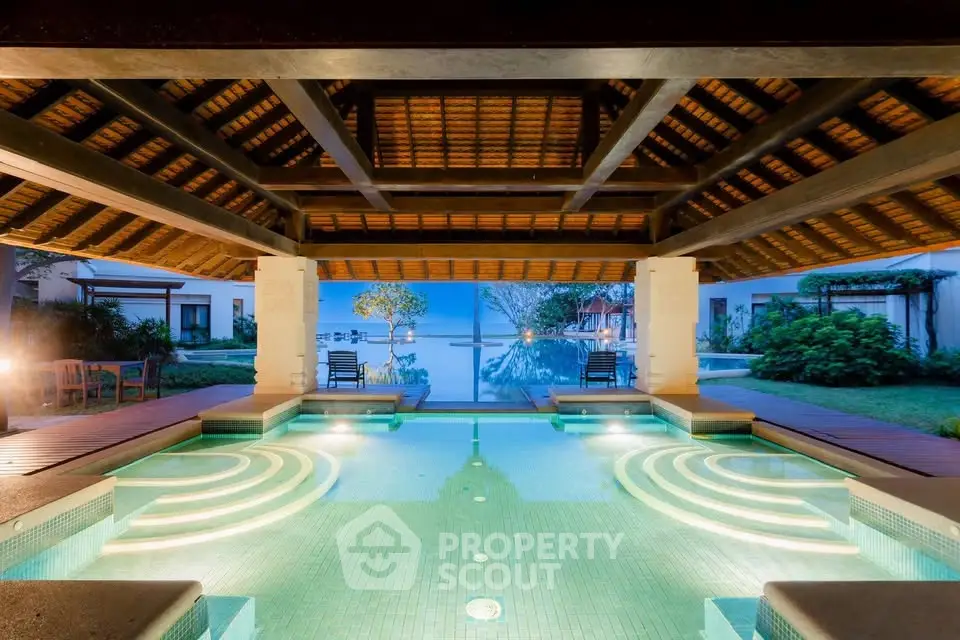 Luxurious poolside view with elegant architecture and serene ambiance