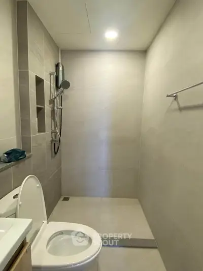 Modern minimalist bathroom with sleek shower and toilet design