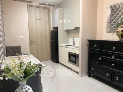 Chic modern kitchen with sleek cabinetry and integrated appliances in cozy apartment