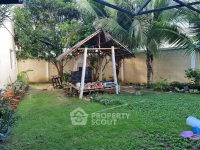 Charming garden oasis with lush greenery and cozy gazebo, perfect for relaxation and outdoor gatherings.