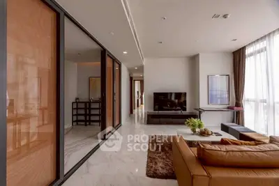 Luxurious modern living room with sleek design and floor-to-ceiling windows