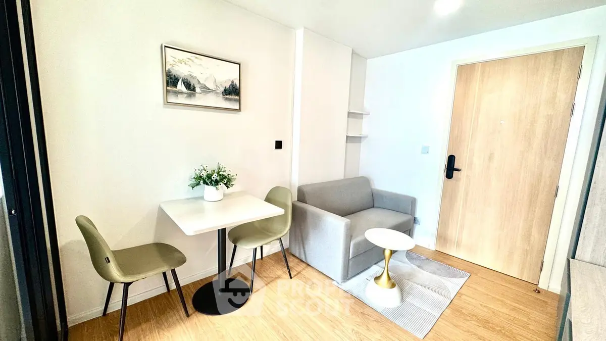 Modern living room with cozy seating and stylish decor in a contemporary apartment.