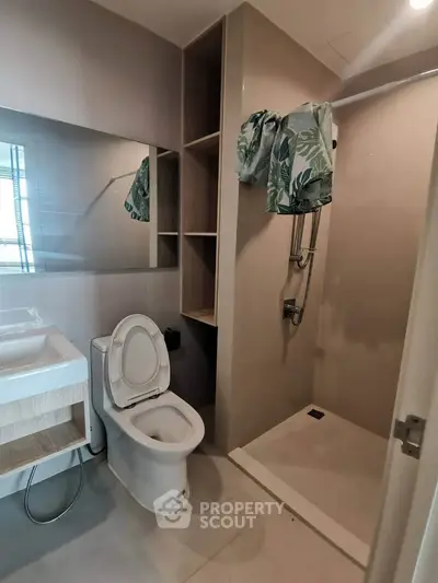 Modern bathroom with shower and toilet in sleek design