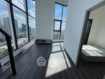 Spacious modern apartment with floor-to-ceiling windows and stunning city views