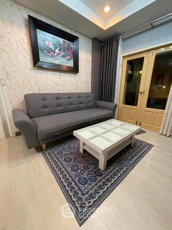 Stylish living room with modern gray sofa and elegant decor