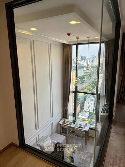 Luxurious high-rise apartment with stunning city view and elegant interior design.