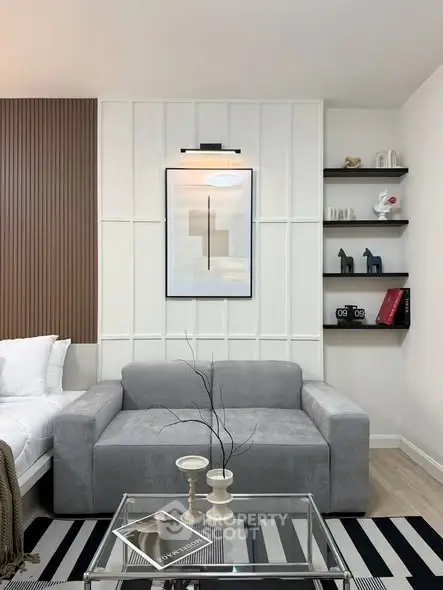 Modern living room with stylish decor and cozy gray sofa