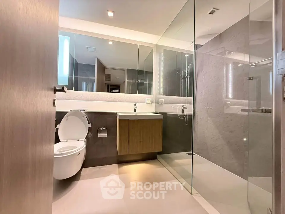 Modern bathroom with glass shower and sleek fixtures