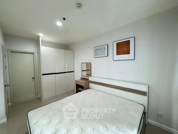 Modern bedroom with minimalist design and ample storage space