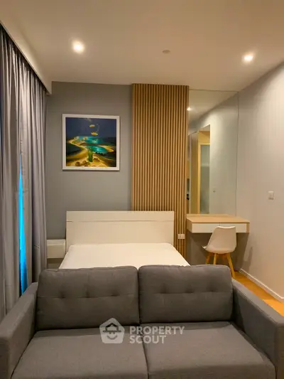 Modern bedroom with stylish decor and cozy seating area