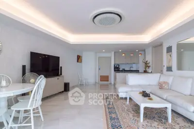 Spacious modern living room with elegant decor and open kitchen layout