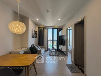 Modern living room with stylish decor and city view balcony