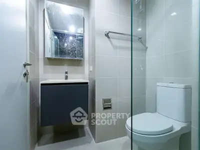 Modern bathroom with sleek fixtures and minimalist design.