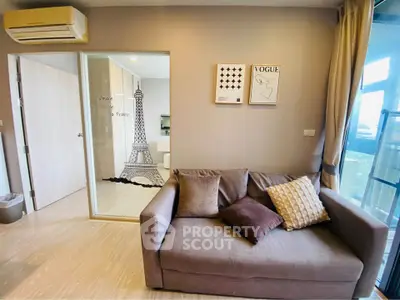 Stylish living room with modern decor and Eiffel Tower wall art, perfect for urban living.