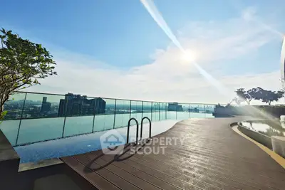 Stunning rooftop infinity pool with panoramic city views and modern design.