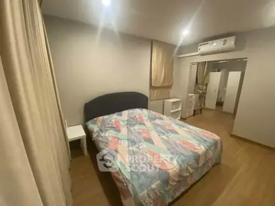 Cozy bedroom with modern decor and air conditioning, perfect for restful nights.