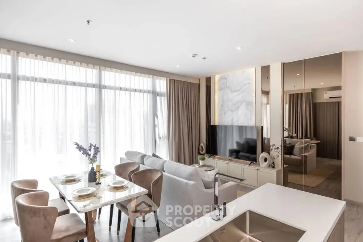 Spacious modern living room with dining area and large windows in a luxury apartment.