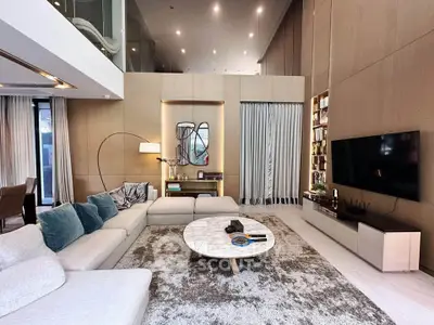 Luxurious modern living room with high ceilings and elegant decor
