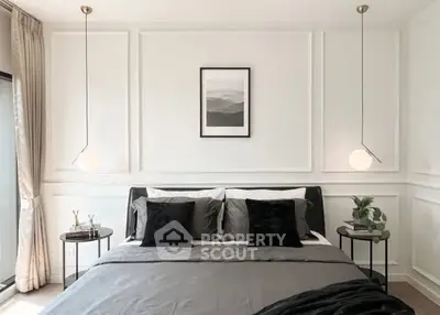 Elegant bedroom with modern decor and stylish lighting, perfect for a cozy retreat.