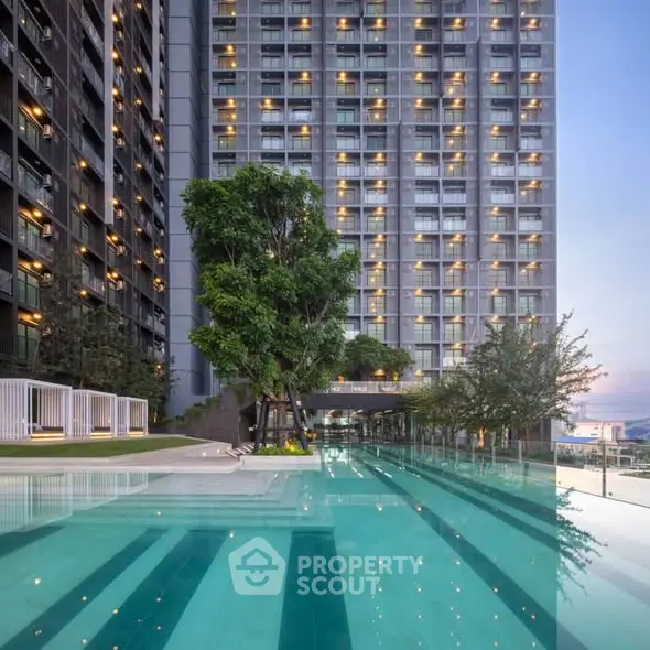 Luxurious high-rise building with stunning pool and modern design.