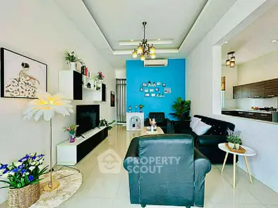 Stylish modern living room with elegant decor and open kitchen layout