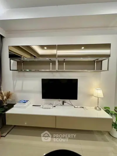 Modern living room with sleek TV unit and elegant decor