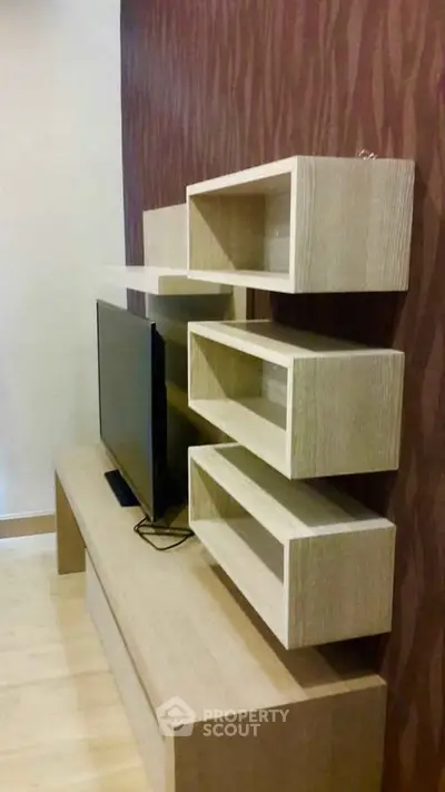 Modern living room with stylish TV stand and wooden shelving unit