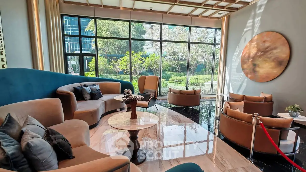 Luxurious living room with elegant furniture and large windows offering garden views.
