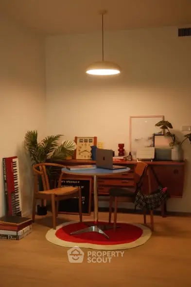 Chic study area with modern furniture and ambient lighting, perfect for productivity and style.