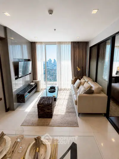 Luxurious modern living room with city view, sleek furniture, and elegant decor in high-rise apartment.