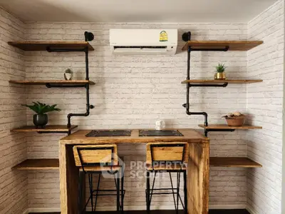 Charming rustic-style kitchenette with natural wood countertops, industrial pipe shelving, and exposed brick walls, perfect for cozy urban living.