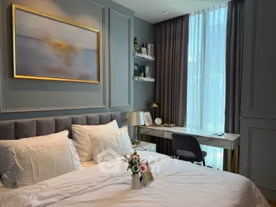 Luxurious bedroom with elegant decor and large window in modern apartment