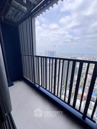 Stunning high-rise balcony with panoramic city views, perfect for urban living enthusiasts.