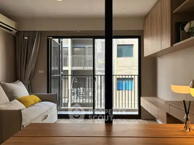Modern living room with balcony view in urban apartment