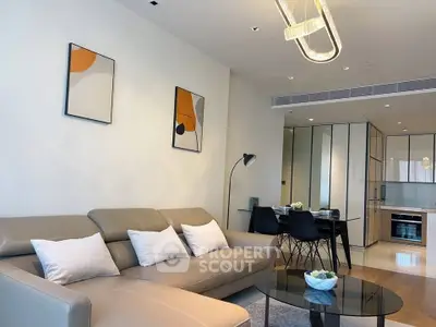 Modern living room with stylish decor and open kitchen layout in a contemporary apartment.