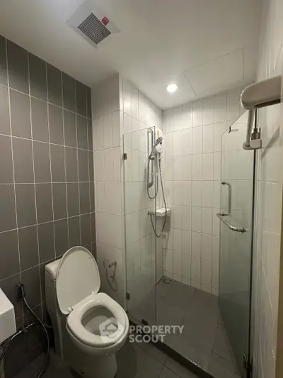 Modern bathroom with glass shower and sleek tile design