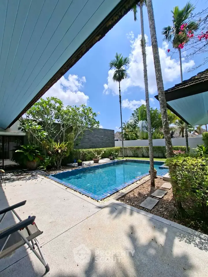 Luxurious tropical villa with private pool and lush garden, perfect for relaxation and entertaining.