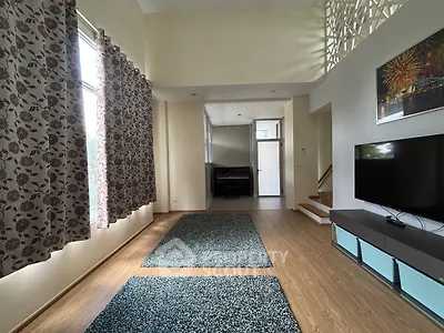 Spacious living room with high ceilings and modern decor